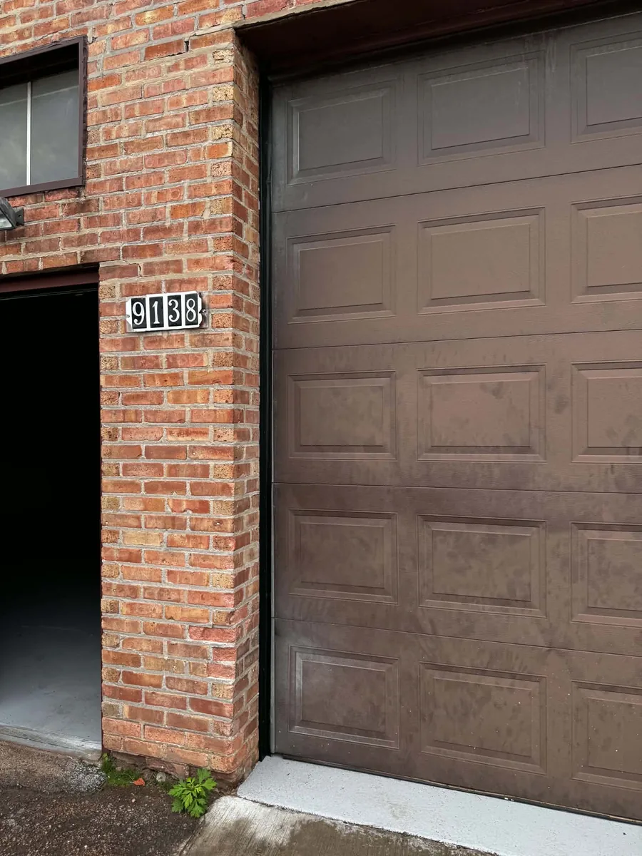 Before: faded, blotchy garage door finish