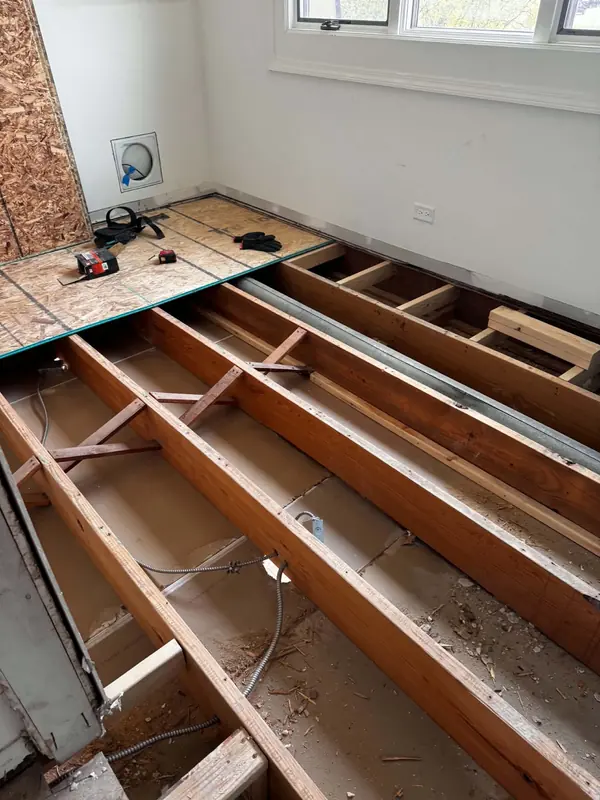 Floor opened to the joists with new blocking installed